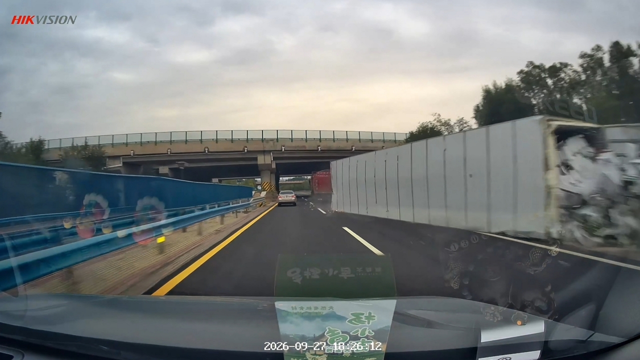 Video thumbnail for Trailer Truck Overturns Near Passing Car on Ningxia Highway