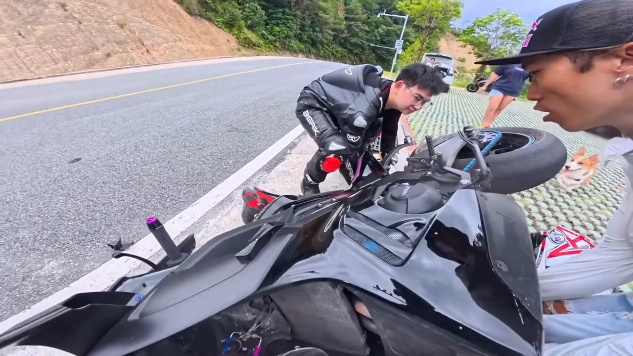 Video thumbnail for China: A motorcyclist takes a tumble on a winding mountain road.