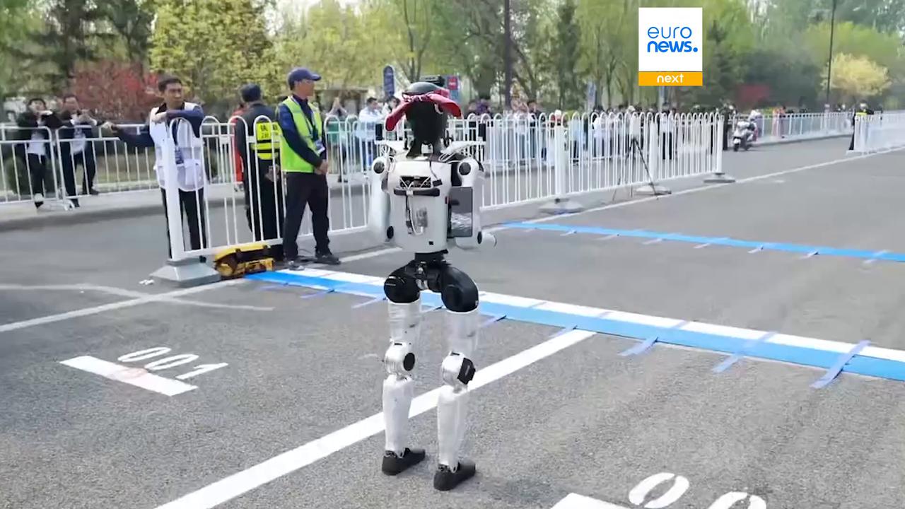 Video thumbnail for Humanoid robot smashes human half-marathon world record in Beijing race