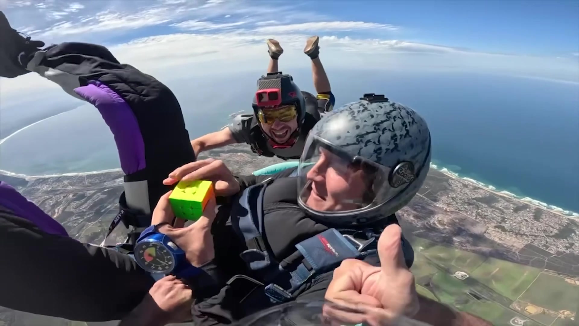 Video thumbnail for Fastest time to solve a rotating puzzle cube whilst in freefall