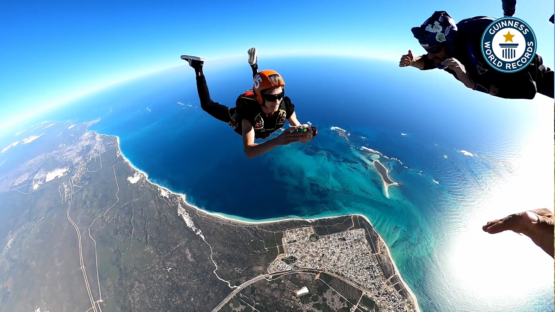 'Video thumbnail for Breaking the record, solving a rubik's cube while skydiving'