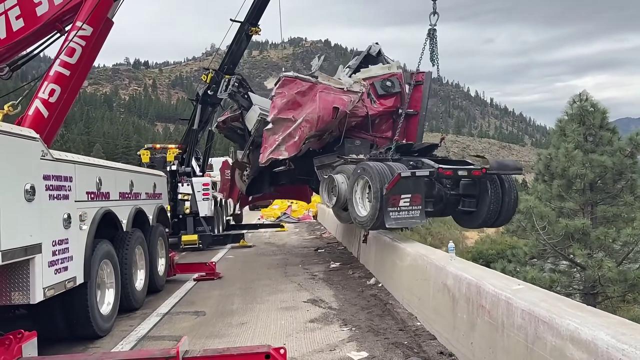 Video thumbnail for US: Big Rig Cab Left Hanging 80 Feet Off California Bridge In Dramatic Rescue Operation.
