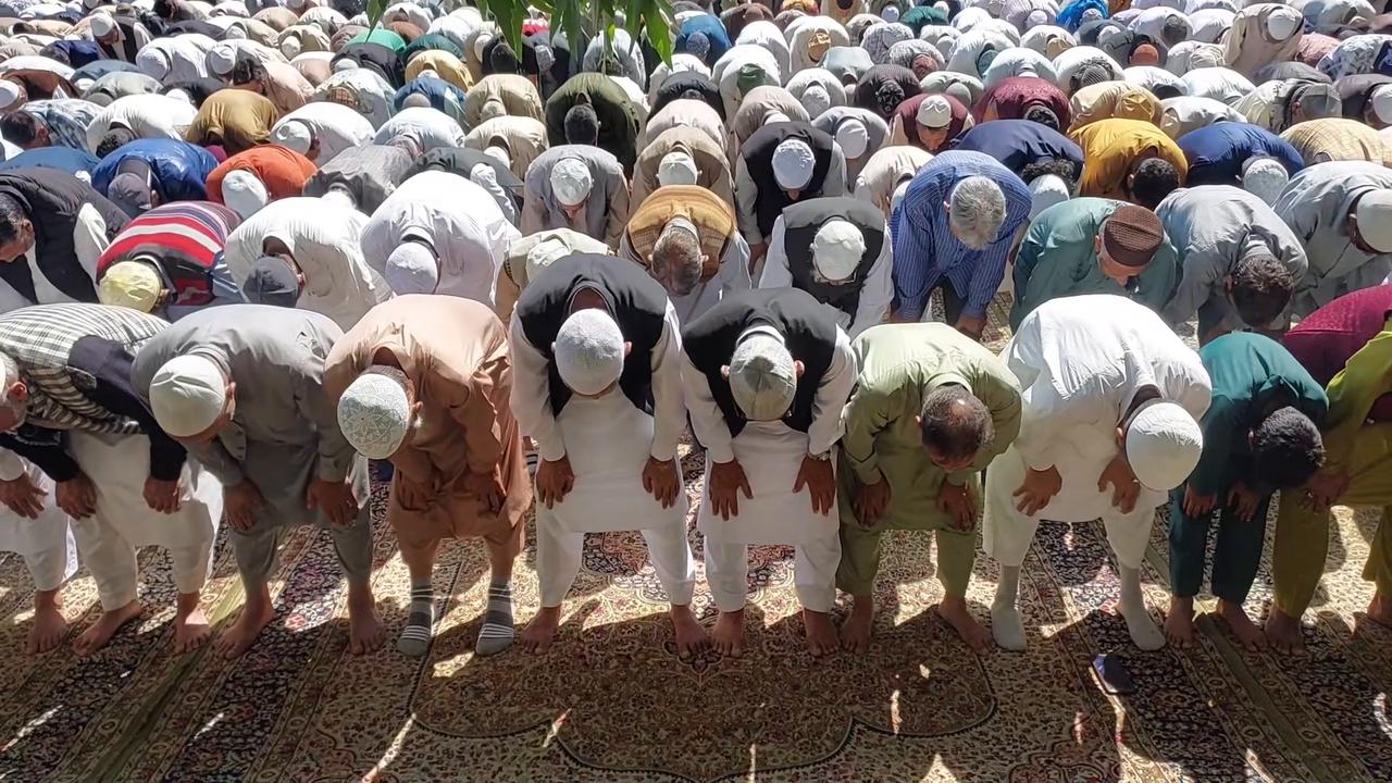 Video thumbnail for India: Hundreds of Muslims in Srinagar, India gather for Eid al-Adha prayers.