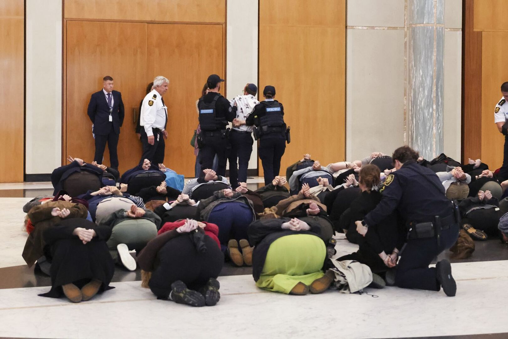 Video thumbnail for Protesters simulate Israeli mistreatment of flotilla activists inside Australian parliament