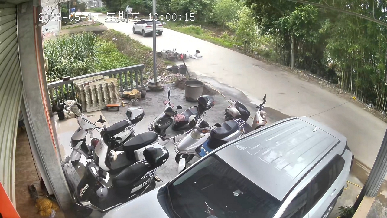 Video thumbnail for Motorcycle Crashes into Canal on Rural Road in Guangxi