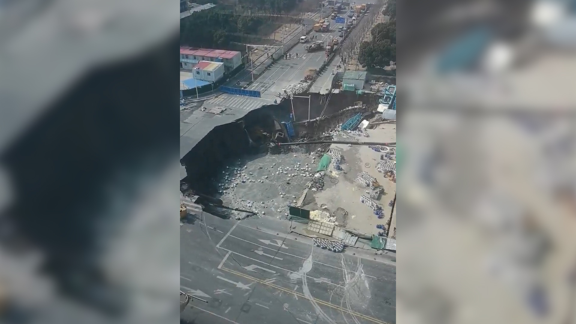 Video thumbnail for CCTV video captures moment sinkhole swallows road in Shanghai