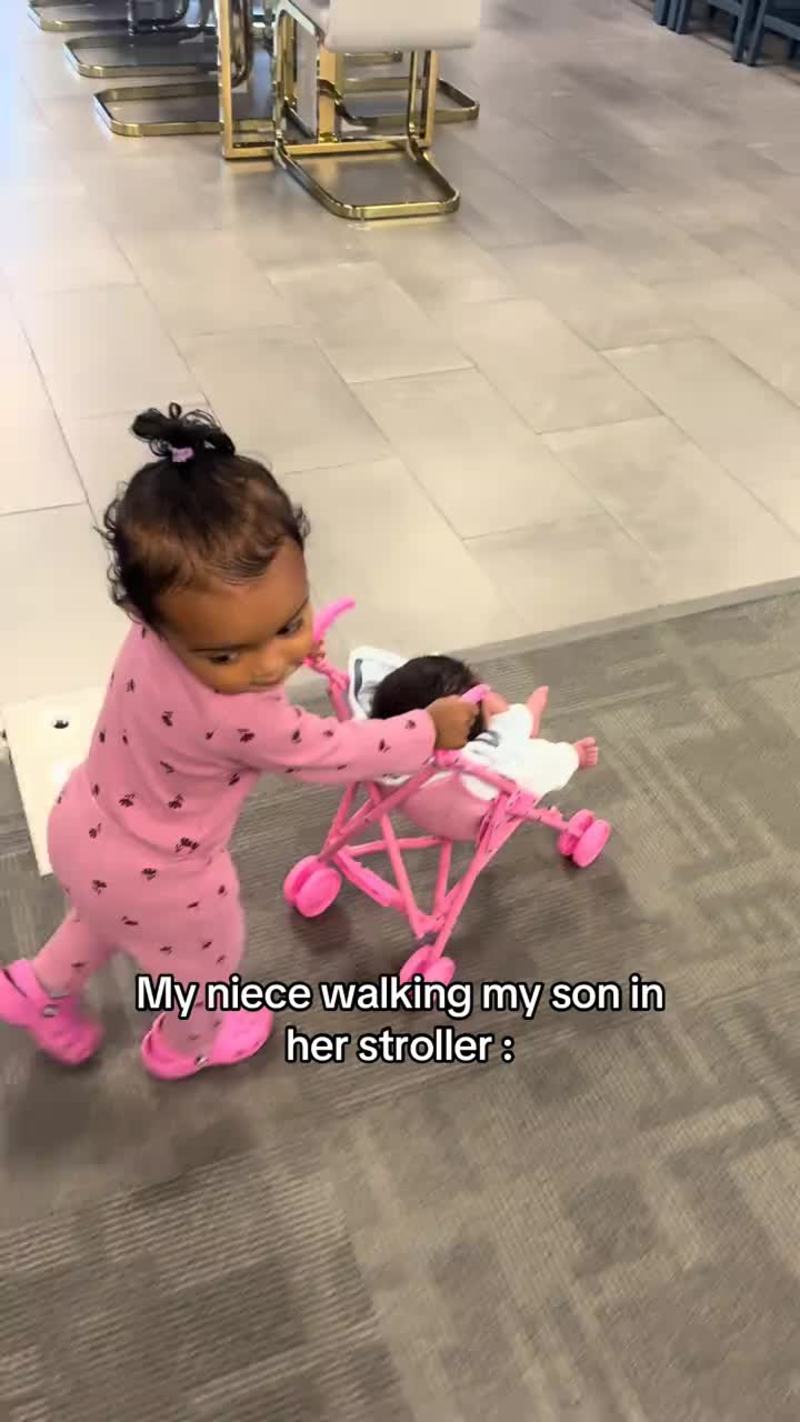 Video thumbnail for Toddler Cousin Proudly Pushing Newborn in Tiny Pink Stroller