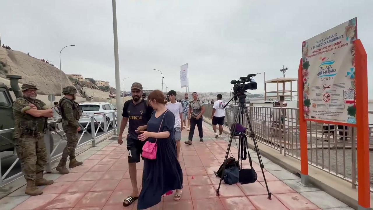 Video thumbnail for Spain: Hundreds Of Migrants Move Through Spain Coast After Mass Border Crossing From Morocco.