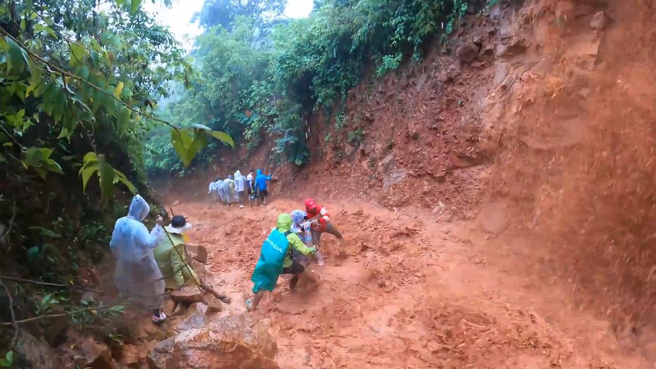 Video thumbnail for Cambodia: Hikers Brave Treacherous Mud Trail After Heavy Rain.