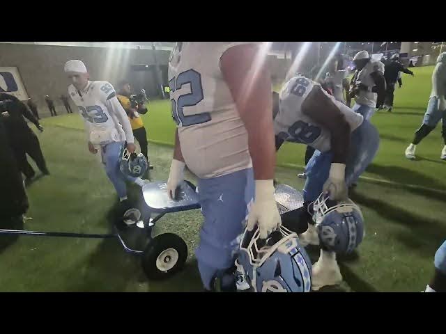 Video thumbnail for #UNC players wheel the Victory Bell from the field to the dressing room