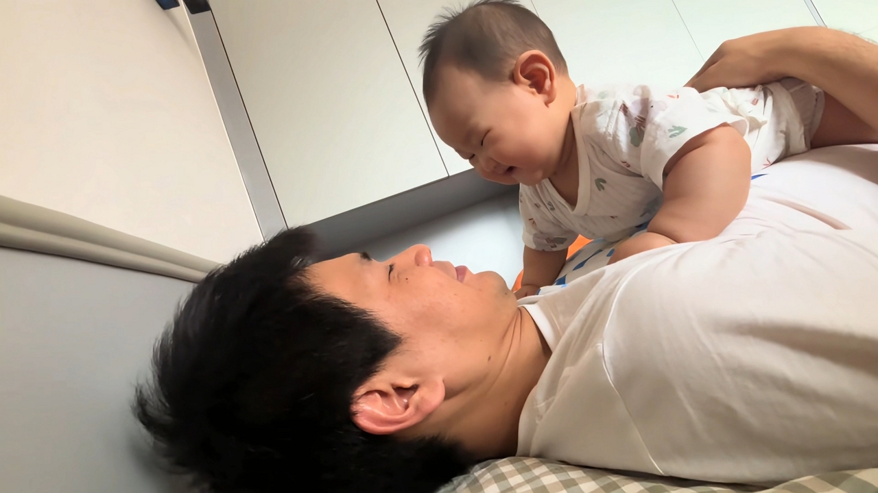 Video thumbnail for Dad and Baby Share a Sweet Playful Moment