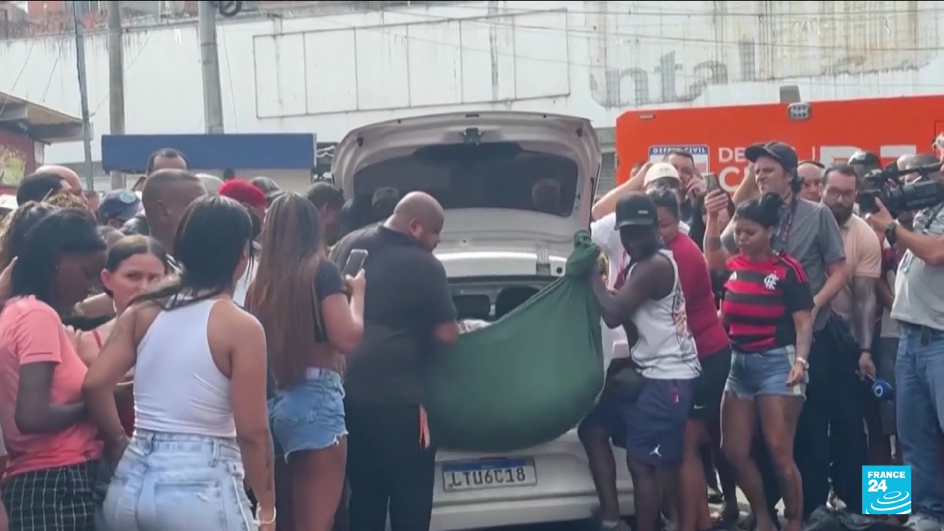 'Video thumbnail for Brazilians in a Rio favela line up bodies after the city's deadliest police raid'