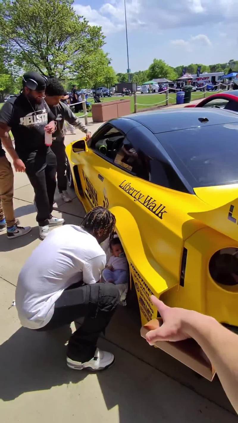 Video thumbnail for Baby in the Supercar Wheel Photo at Car Meet