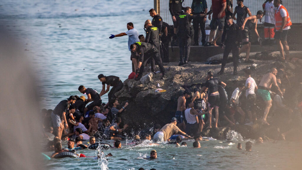 Video thumbnail for What to know about the arrival of 49,000 migrants into Spain's Ceuta