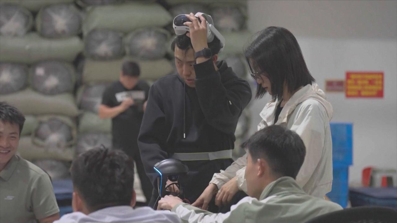 Video thumbnail for China: Humanoid robots engage in full tea-making process.
