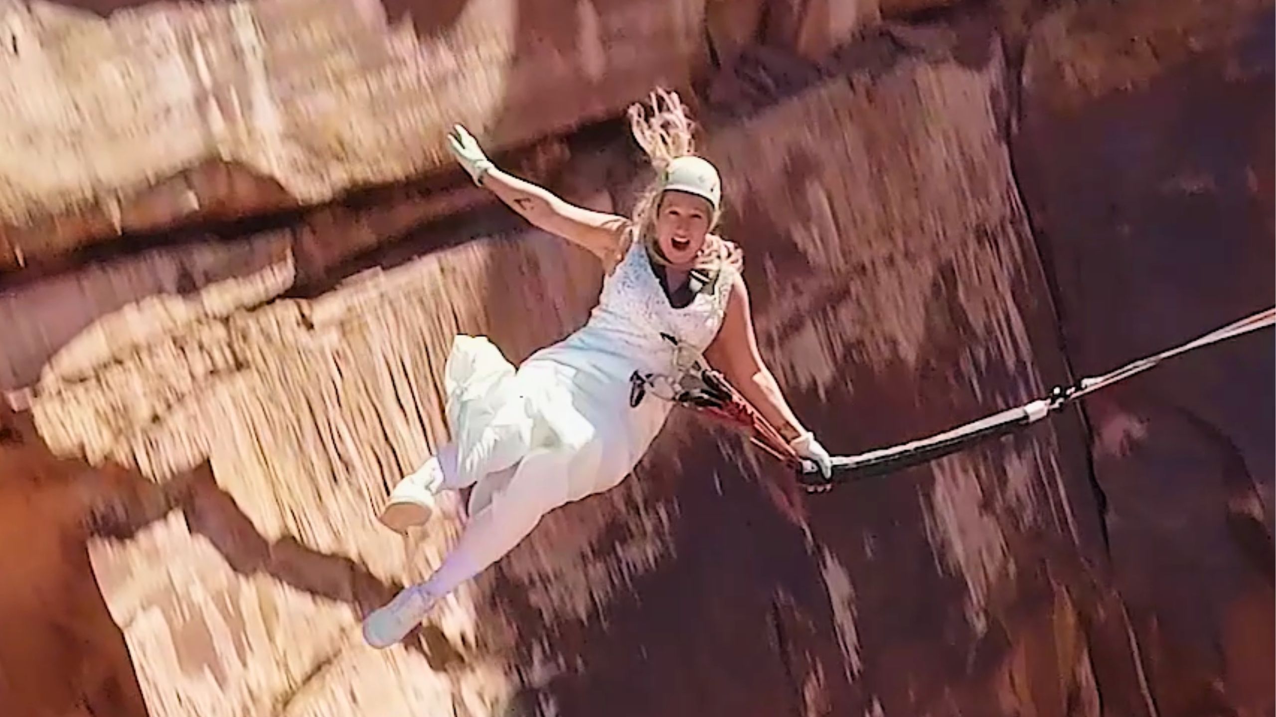 Video thumbnail for Bride And Groom Rope Swing Off Cliff Taking Plunge Into Married Life