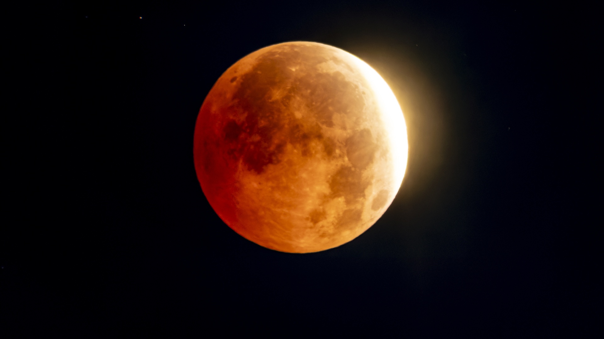 Video thumbnail for Skywatchers get a dramatic look at a moon almost fully eclipsed