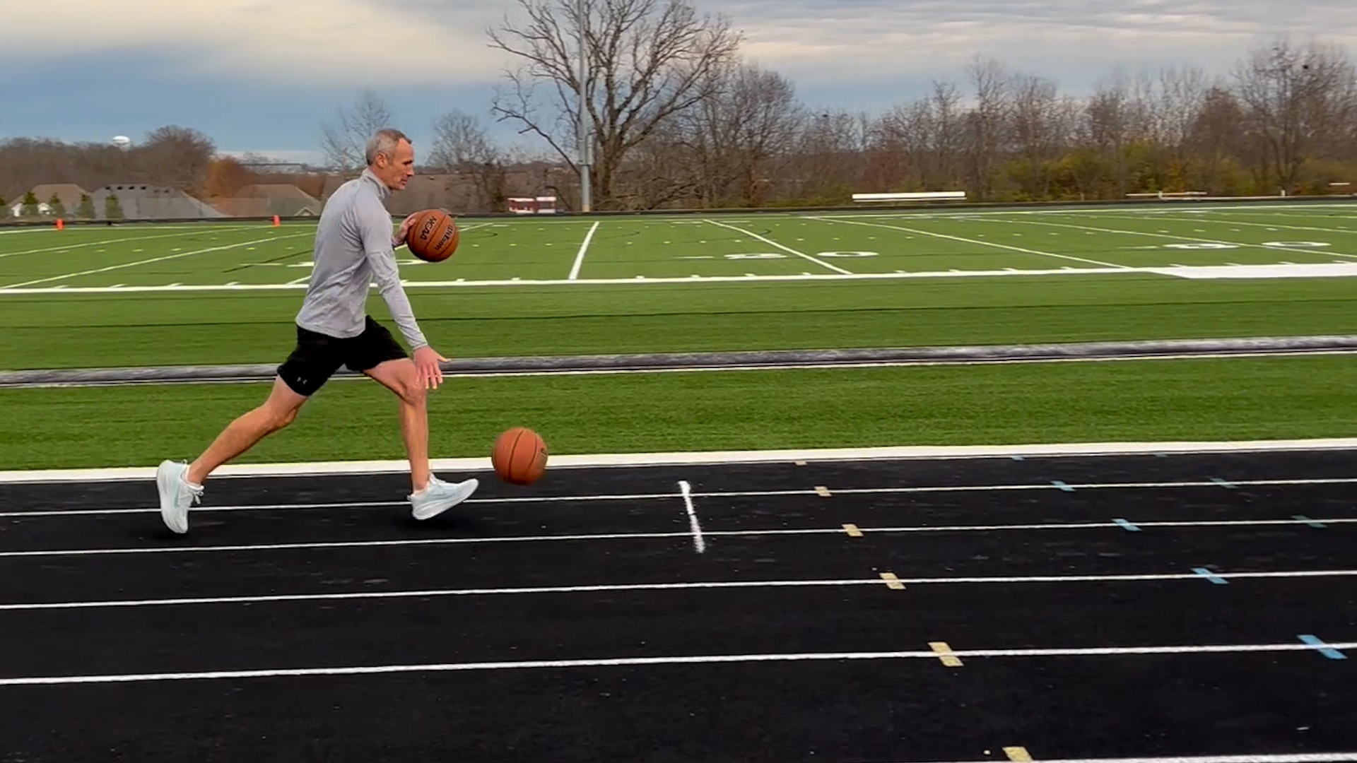 Video thumbnail for Fastest mile dribbling two basketballs - 8 minutes 28.31 seconds by Michael Dodd