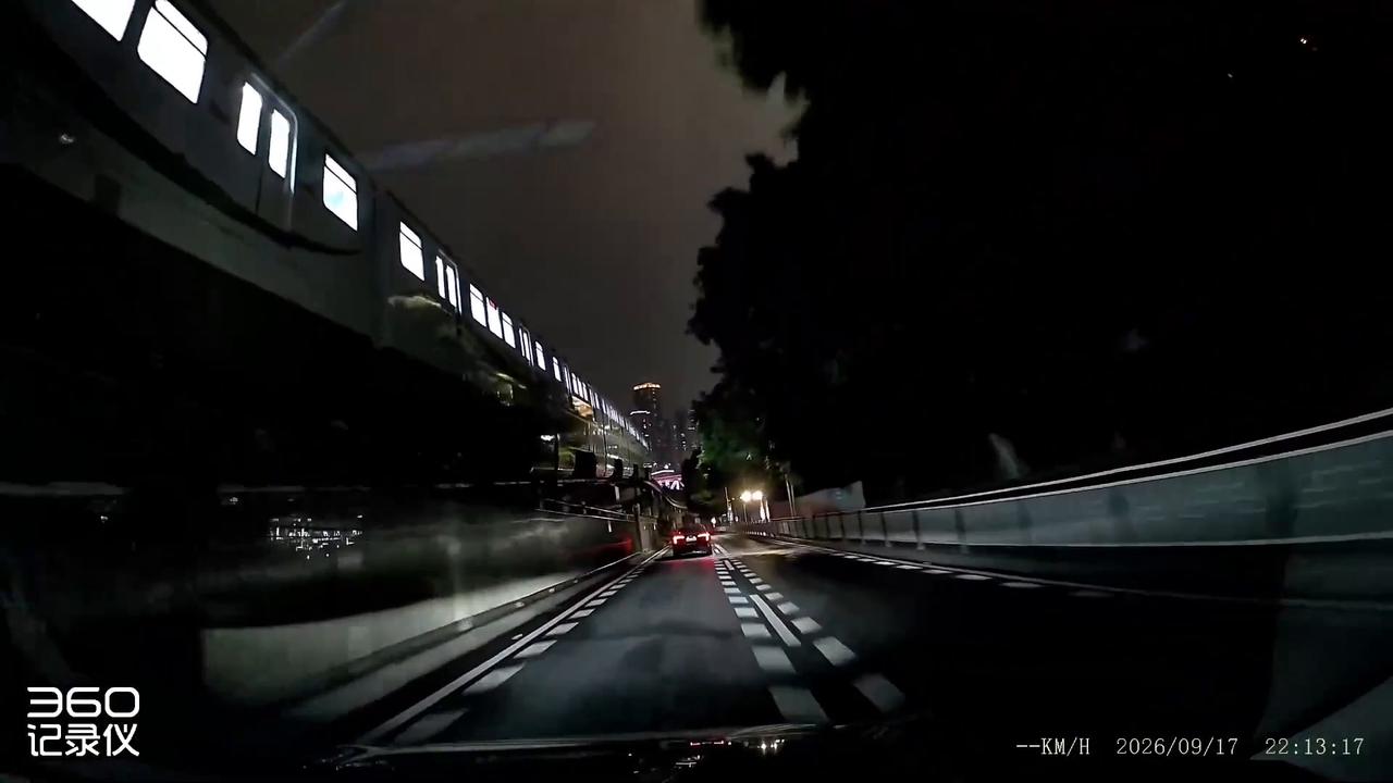 Video thumbnail for China: Viral Dashcam Captures Train Emerging From Road in Chongqing.