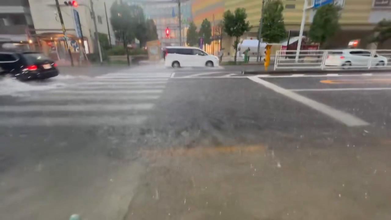 Video thumbnail for Japan: Cars Plough Through Deep Floodwater as Torrential Rain Hits Tokyo.