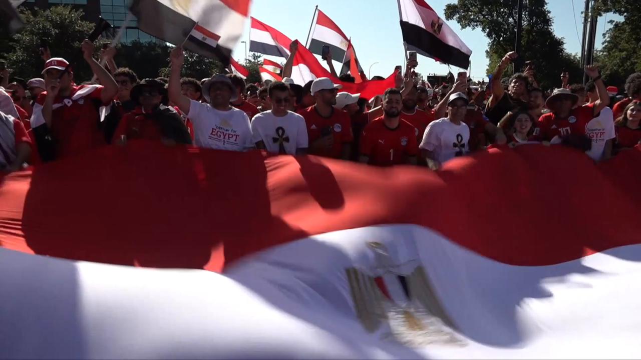Video thumbnail for US: Egyptian fans march to Dallas Stadium ahead of World Cup clash with Australia.