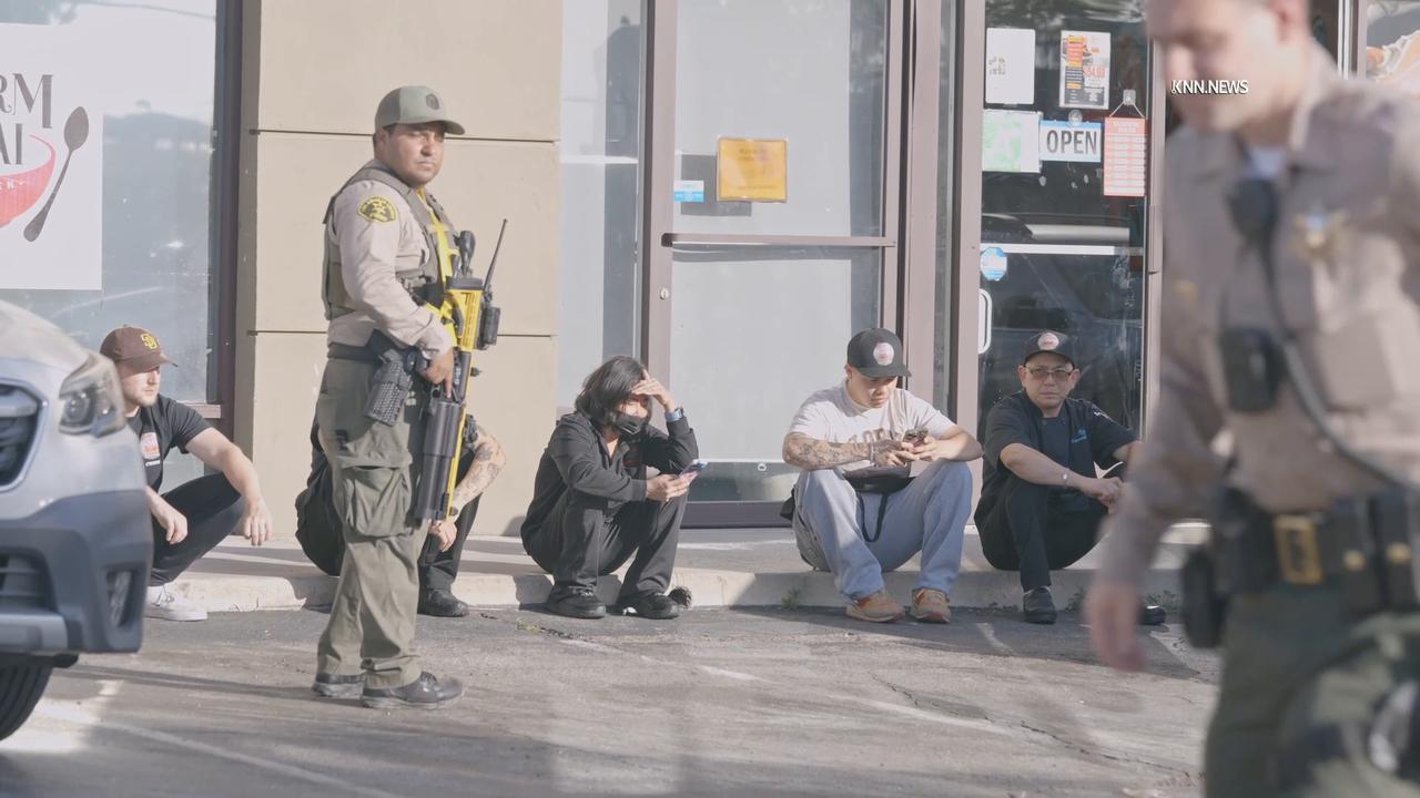 Video thumbnail for US, Tempe: Santa Clarita Rapper Blueface Handcuffed in Swatting Incident at His Restaurant.