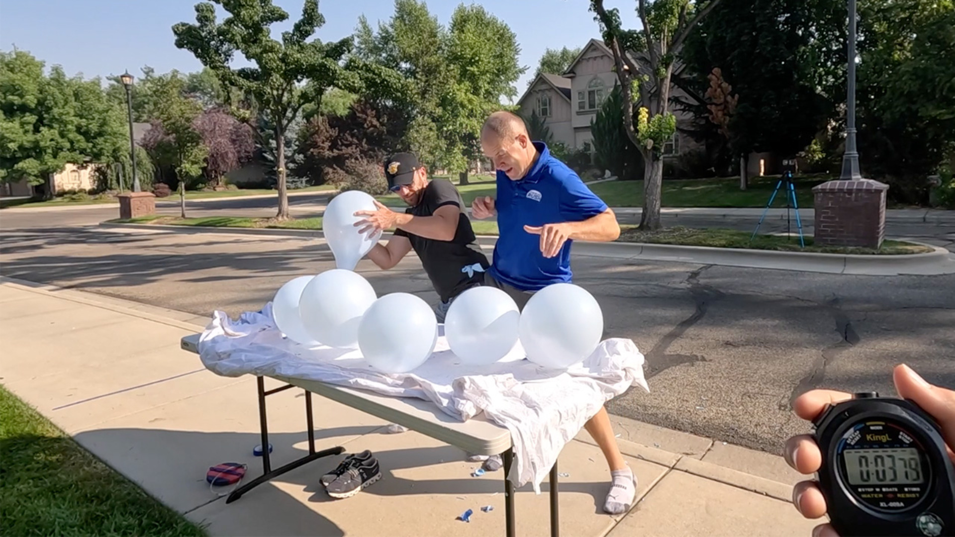 Video thumbnail for Fastest time to pop 10 balloons between two people  7.49 seconds by Jonathan Hannon and David Rush