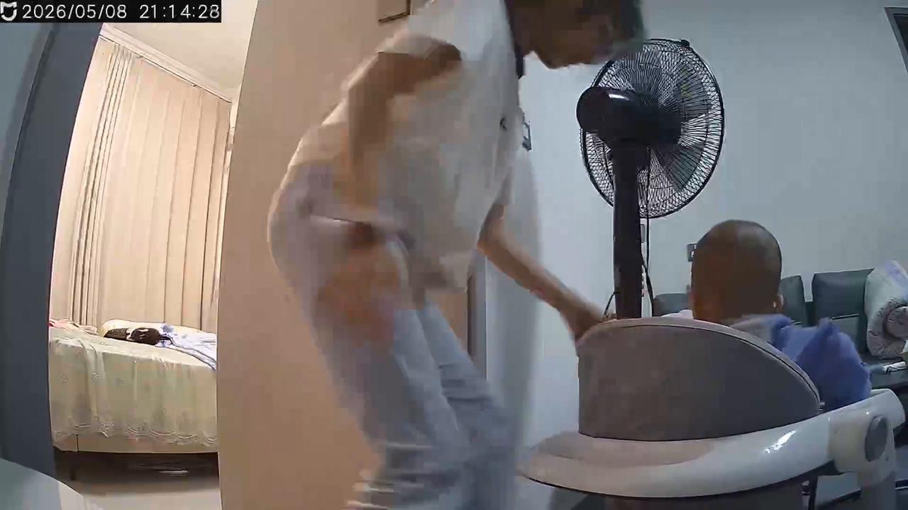 Video thumbnail for China: Chinese baby determinedly pulls away electric fan as sister bursts into laughter.