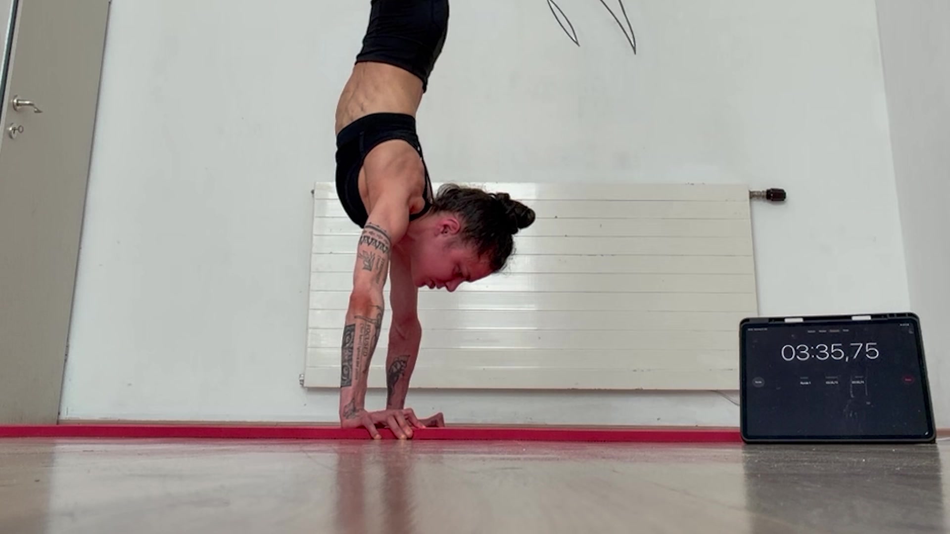 Video thumbnail for Most Consecutive Nose To Ground Handstand Push Ups (Female)