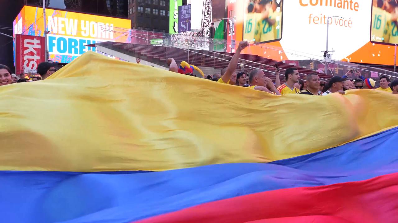 Video thumbnail for US: Colombia fans gather in Times Square ahead of Uzbekistan World Cup match.