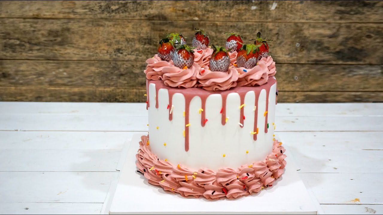 'Video thumbnail for Pink cream drip cake decoration with strawberry'