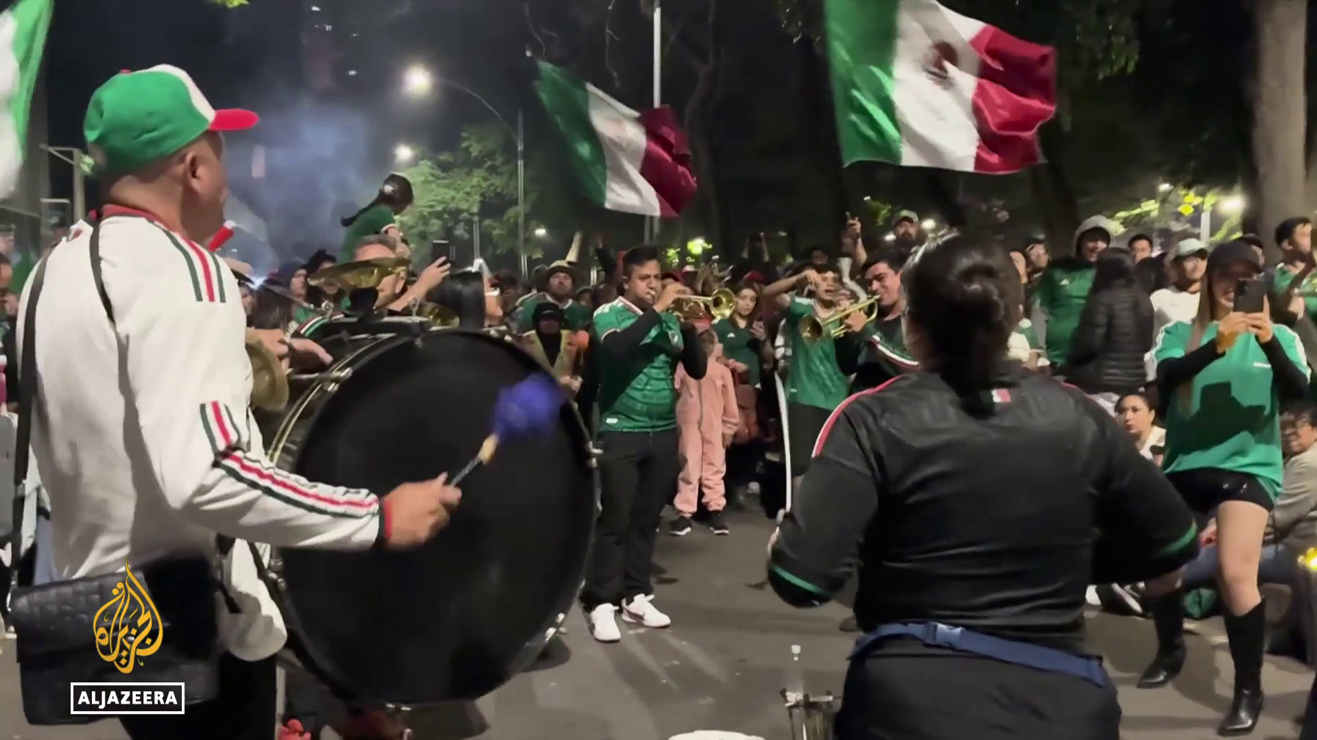 Video thumbnail for Mexico's world cup passion: Fans embrace tournament as team reaches last 16