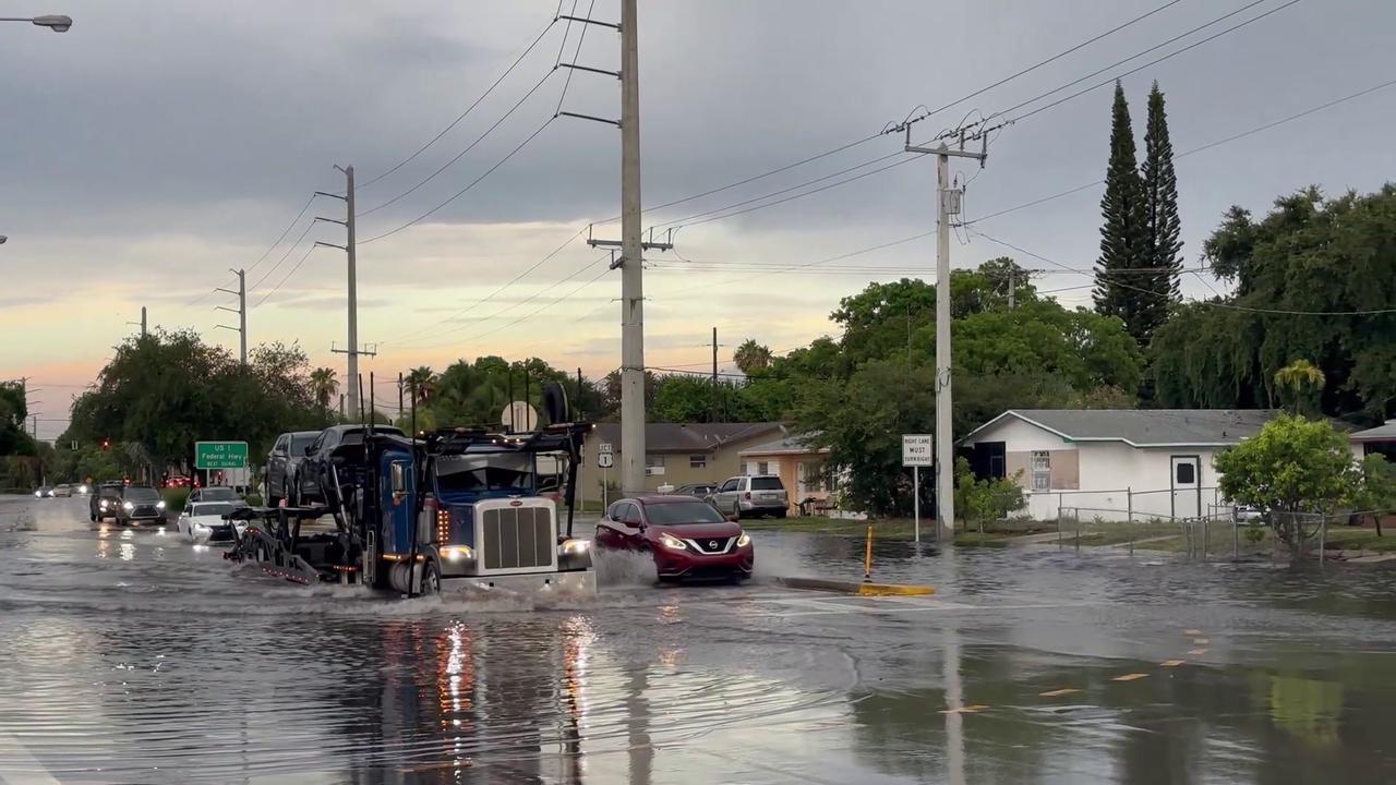 Video thumbnail for US: Vehicles Drive Through Major Street Flooding in Hollywood.