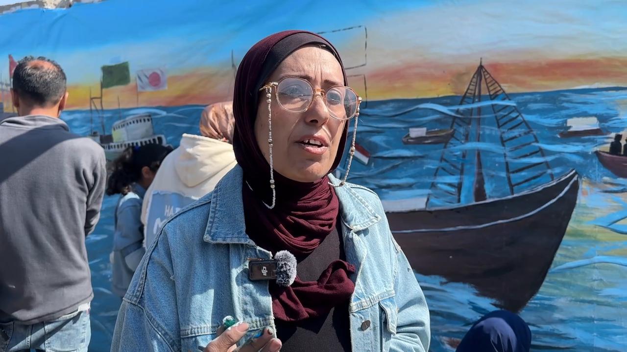 Video thumbnail for Palestinian artists paint a mural of the "Global Freedom Flotilla" intercepted by Israel.