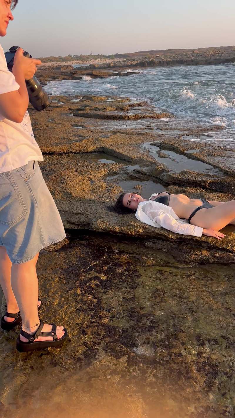 Video thumbnail for Ocean Wave Crashes over Bikini Photoshoot on Rocky Shore