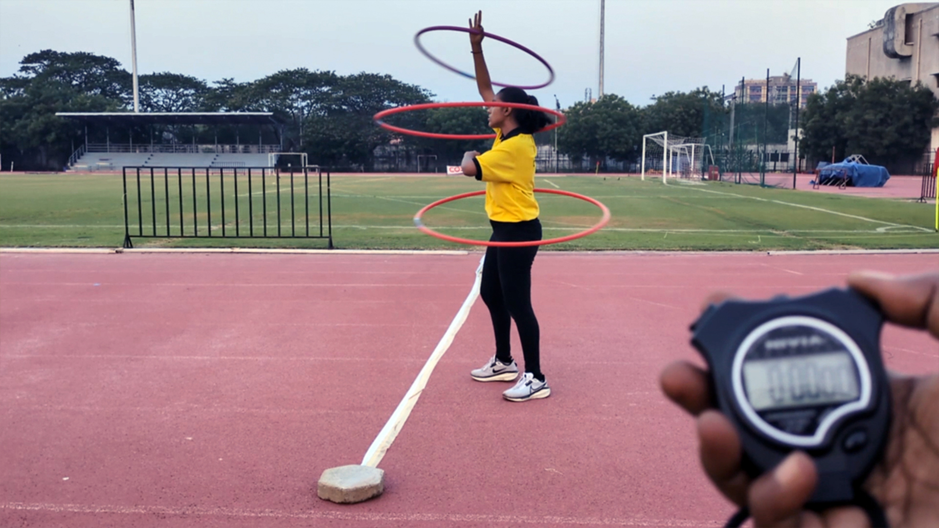 Video thumbnail for Fastest 100m while spinning three hula hoops (female)  32.01 seconds by Janani .R.S