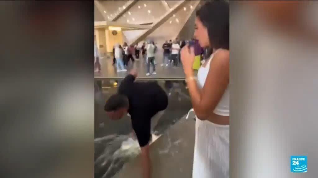 Video thumbnail for The Grand Cairo Museum visitors so captivated that they fall into water