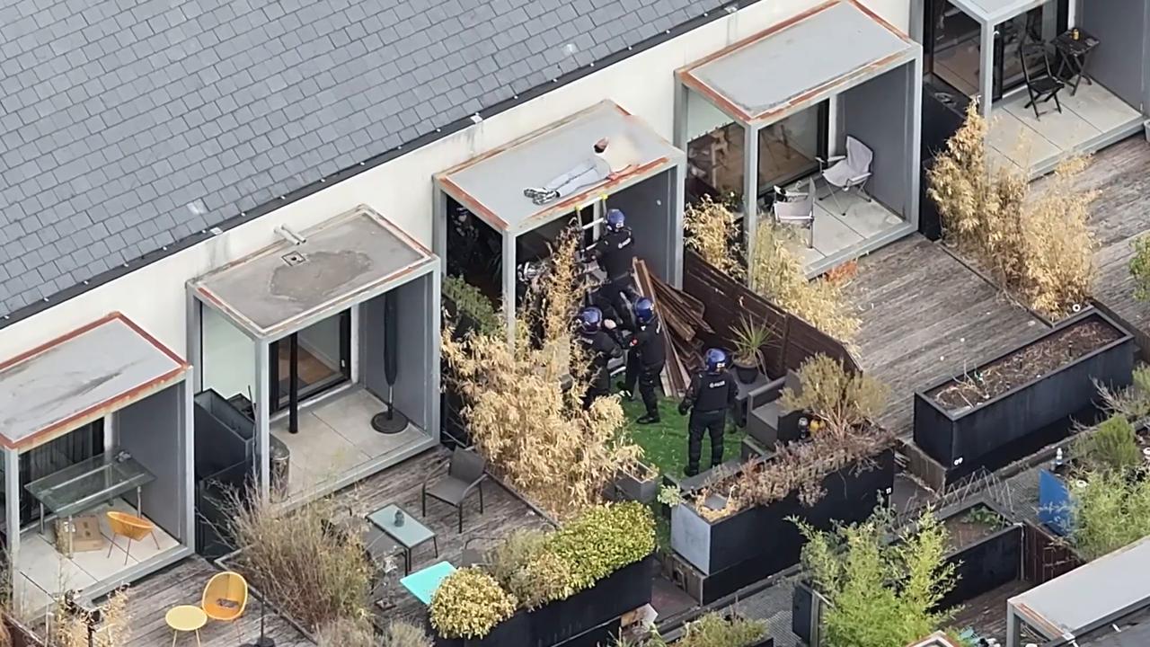 Video thumbnail for UK: Police end 48-hour standoff after suspect falls asleep on roof in England.