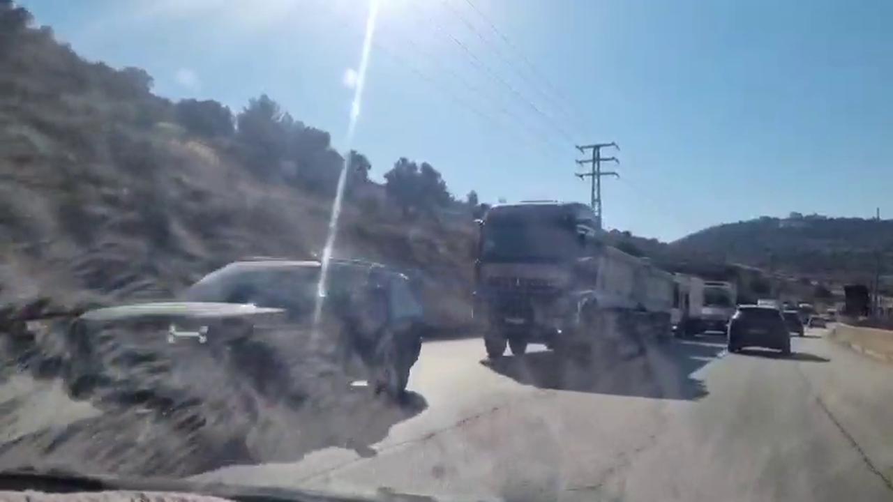 Video thumbnail for Dozens of Palestinian Vehicles Wait at Israeli Checkpoint Near Ramallah.