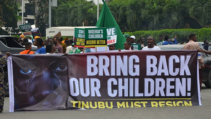 Video thumbnail for Protesters take to streets of Nigerian capital over school abductions