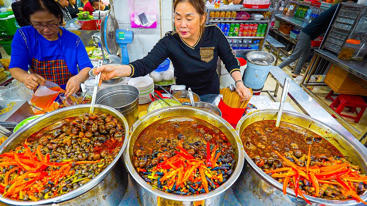 Video thumbnail for VIETNAM STREET FOOD Seafood Paradise Bánh Xèo + CRAZY Snail Feast in Da Nang!