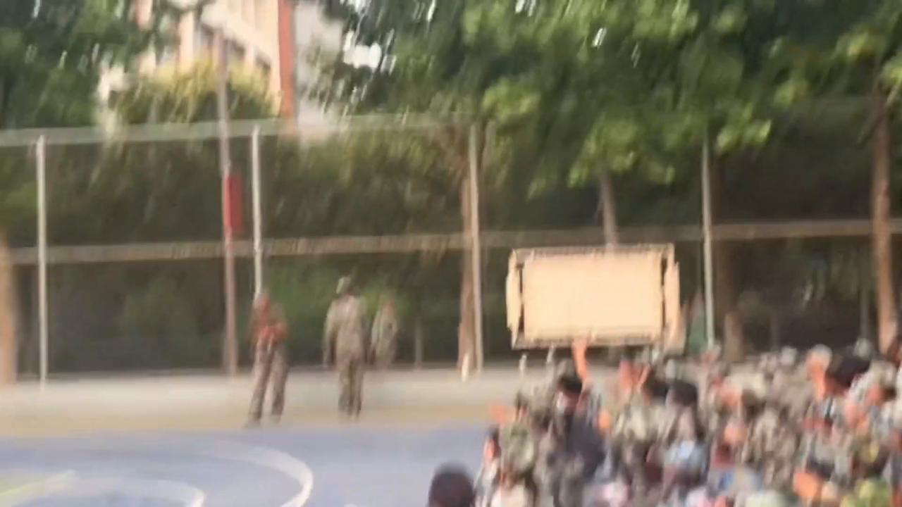 Video thumbnail for China: Student flips over school fence during military training in China.