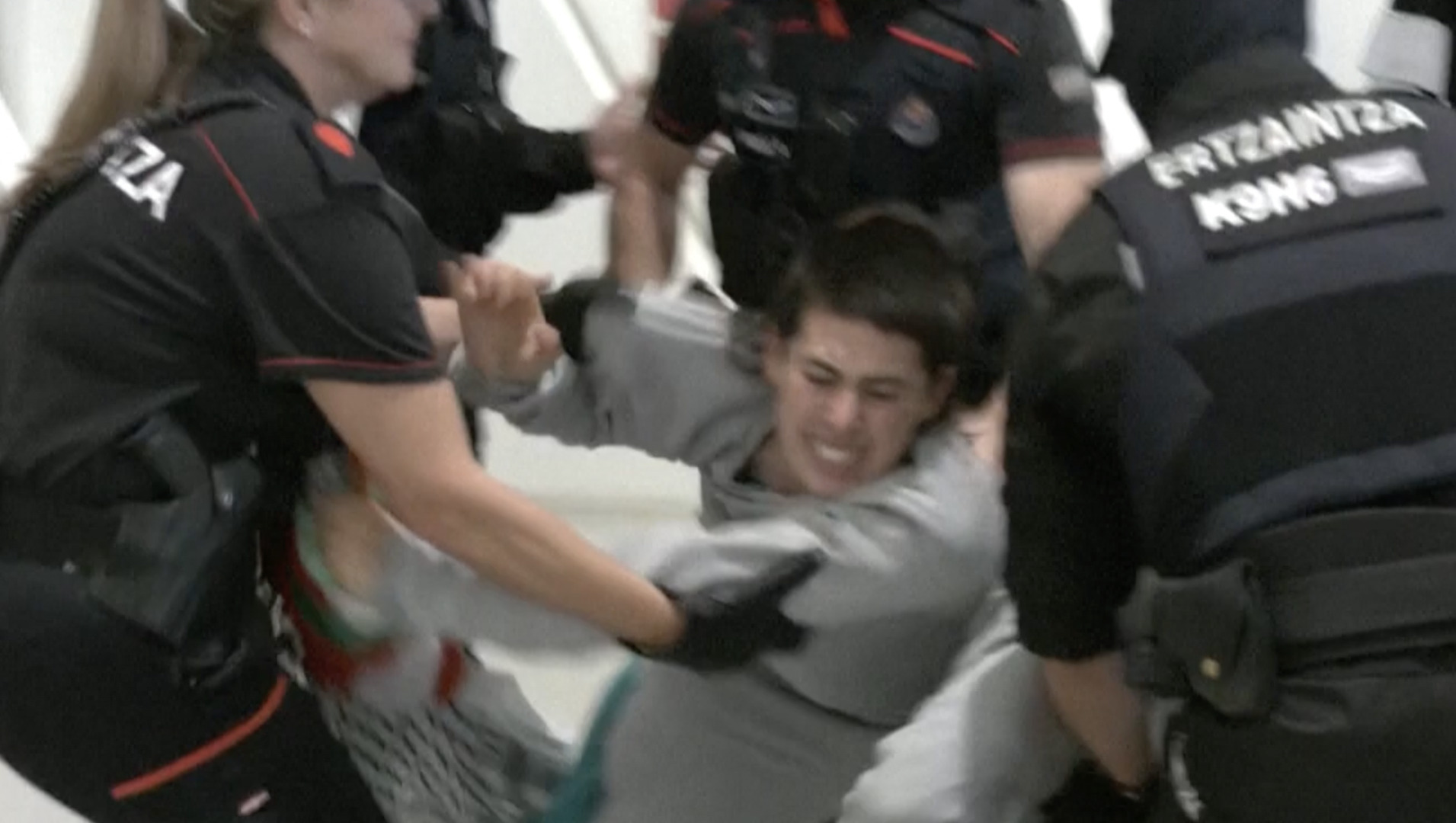 Video thumbnail for Spanish police beat and detain Gaza flotilla activists at airport