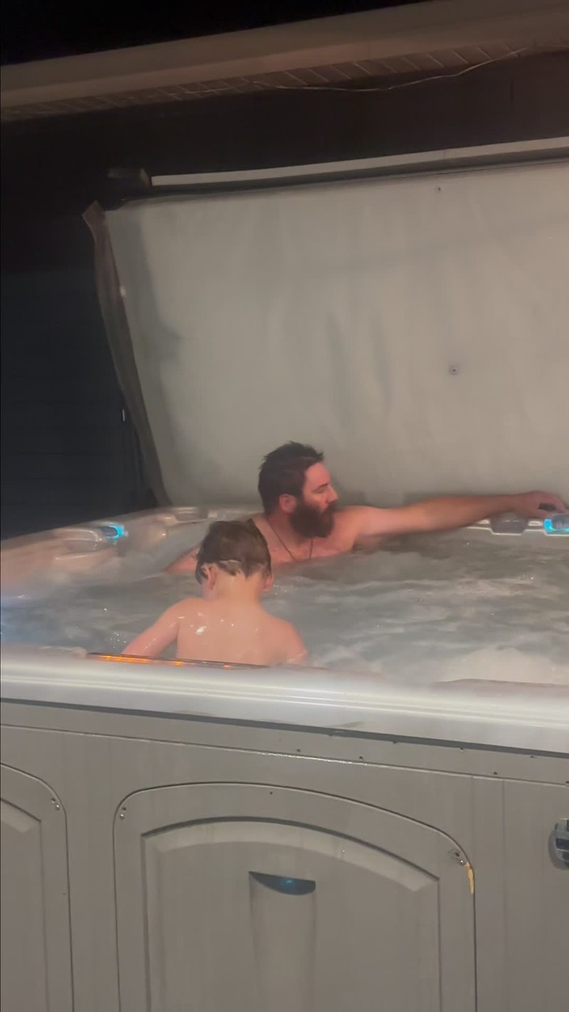 Video thumbnail for Dog Longingly Watching Family Relax in the Hot Tub
