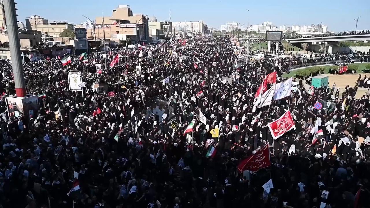 Video thumbnail for Iraq: Thousands gather in Iraq for funeral procession of slain Iranian leader Khamenei (3).