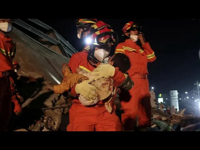 Video thumbnail for Mother and Son rescued 52 hours after the collapse of quarantine hotel in China coronavirus cgtn