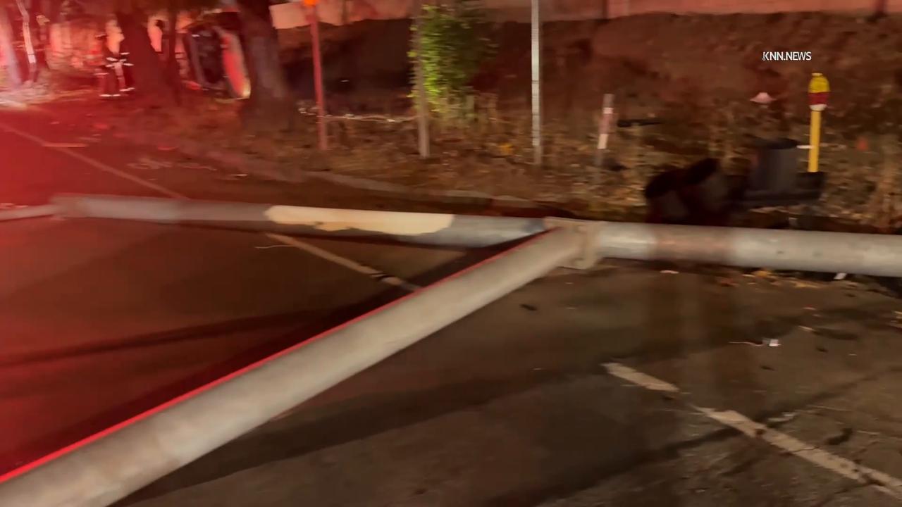 Video thumbnail for US, Los Angeles: Encino SUV Collision Knocks Down Streetlight and Blocks Traffic.