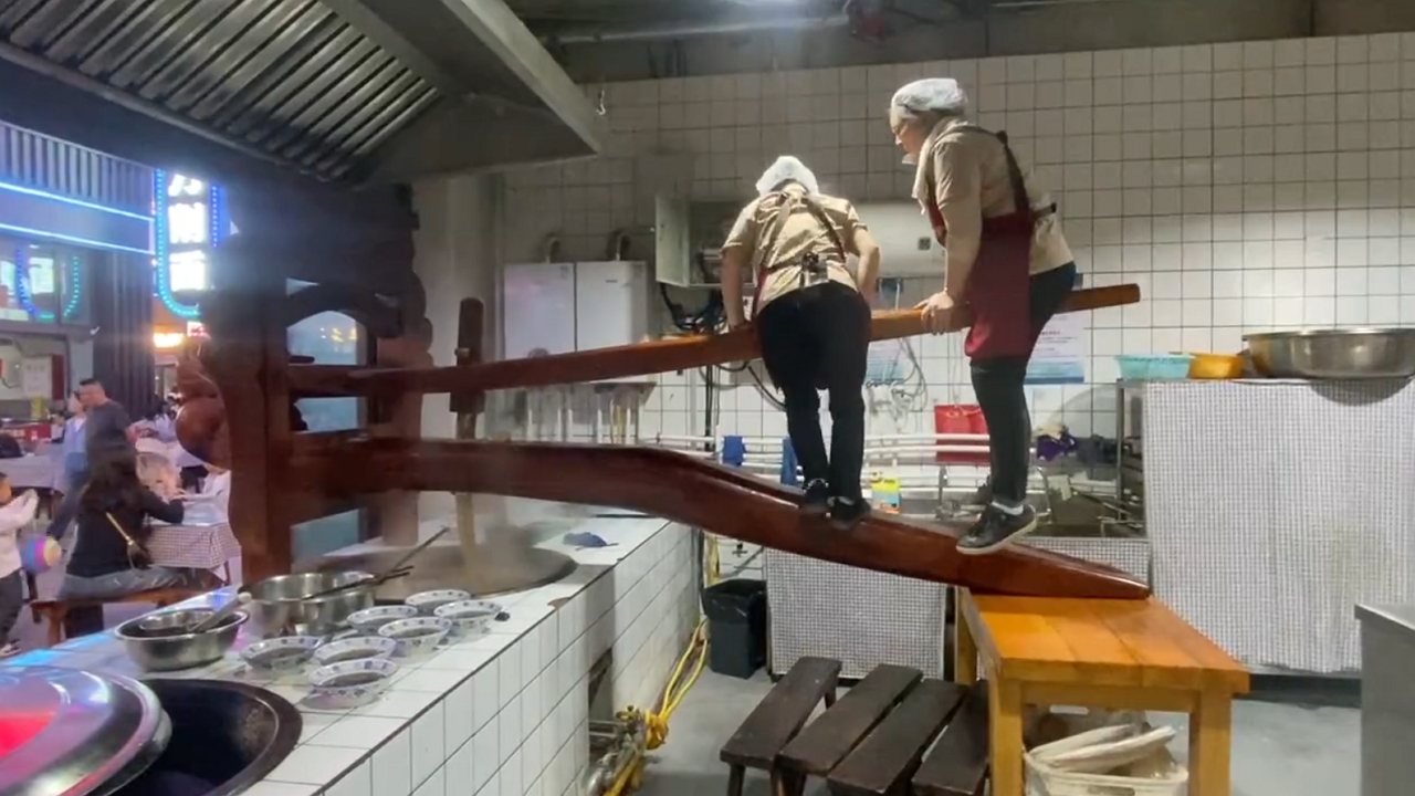 Video thumbnail for Women Ride Giant Noodle Press in Shanxi!