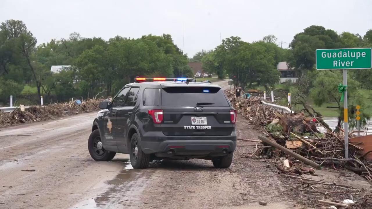 Video thumbnail for US: Flood Debris Blocks Texas Road As Police Vehicle Guards Dangerous Waters.