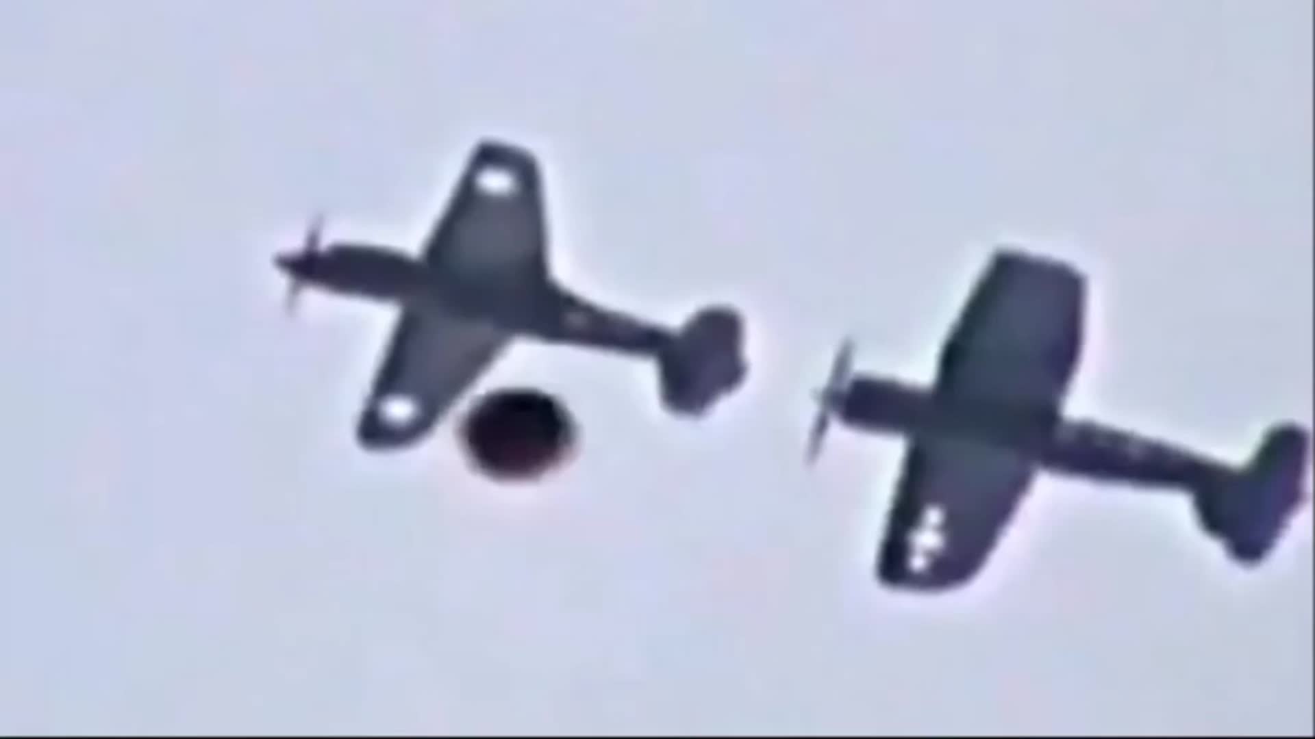 Video thumbnail for Exciting video footage of a UFO passing by planes at an air show in the UK.